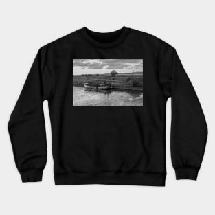 Wooden boat moored in Thurne Dyke in the Norfolk Broads National Park Crewneck Sweatshirt